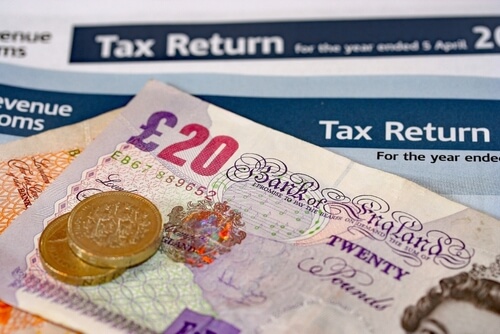 Accountant tax return & UK £20 note and £1 coins